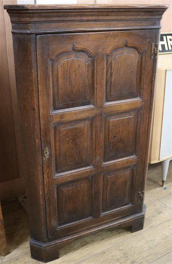 An oak corner cupboard W.71cm